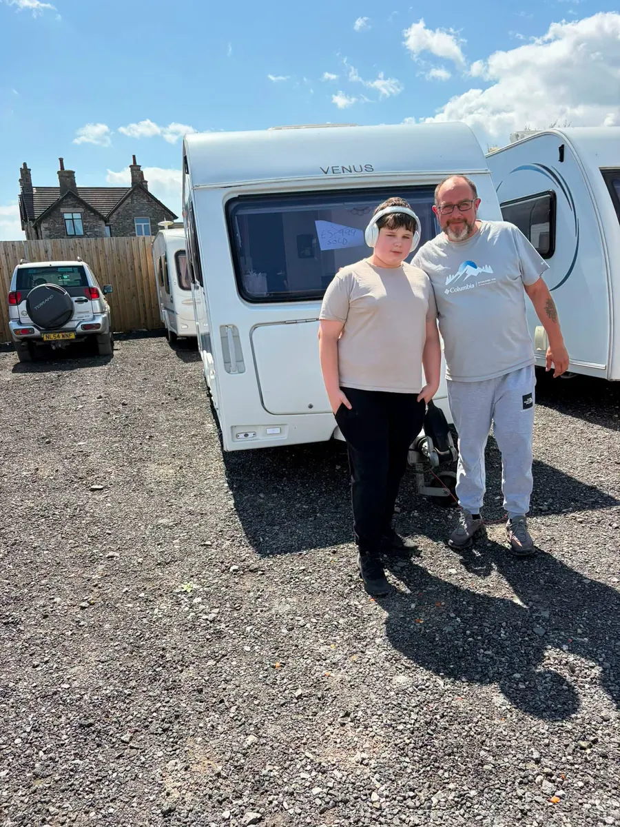 Happy North West Caravans customer with their touring caravan