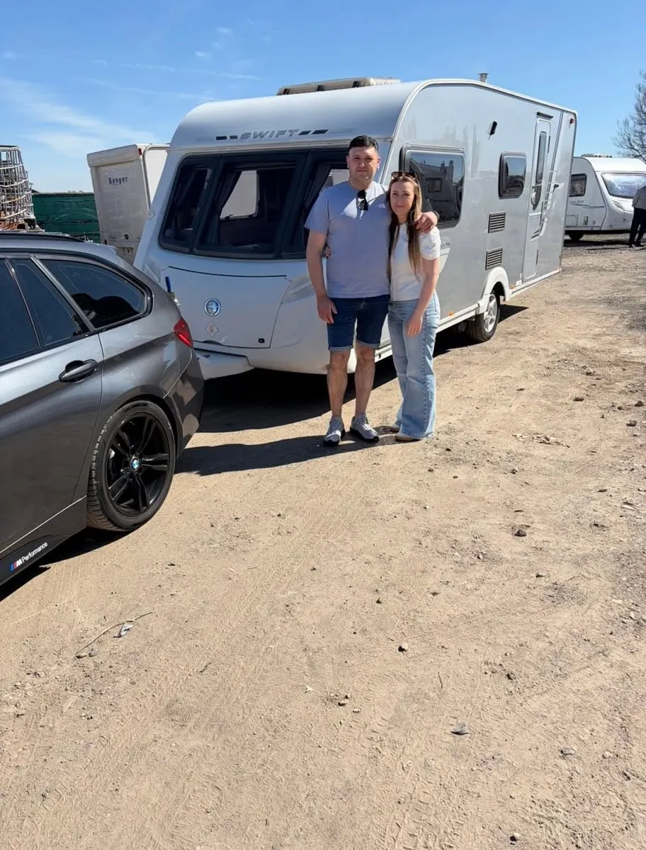 Happy North West Caravans customer with their touring caravan